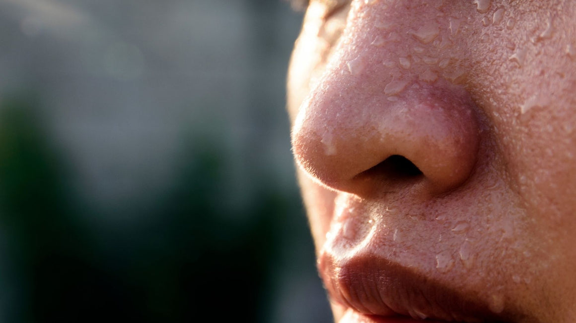 Close-up of a woman's face during a hot flush