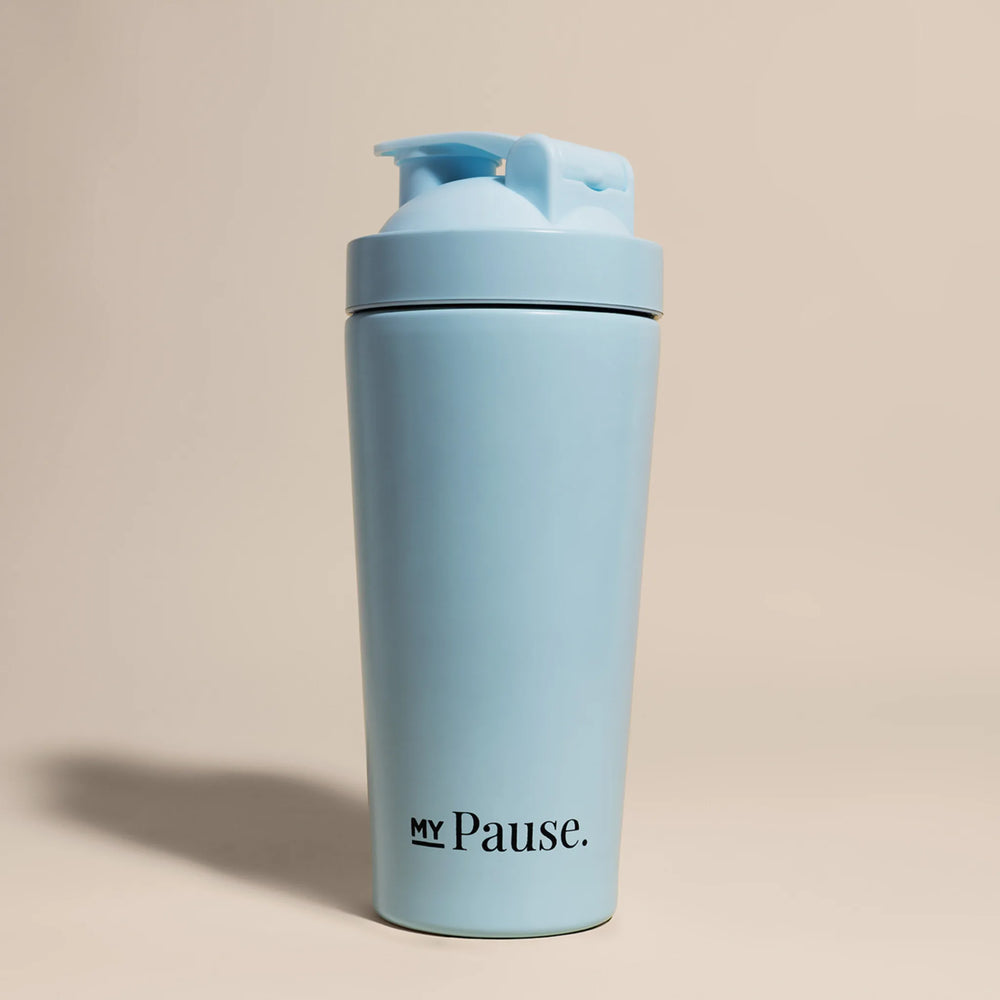 The MyPause steel shaker bottle in light blue, with a matching flip-top lid, on a beige background.