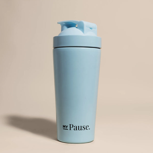 The MyPause steel shaker bottle in light blue, with a matching flip-top lid, on a beige background.